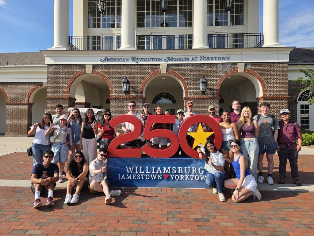 TIA students in front of sign at American Revolution Museum